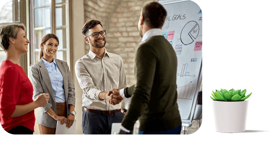 Business partners shaking hands in a modern office